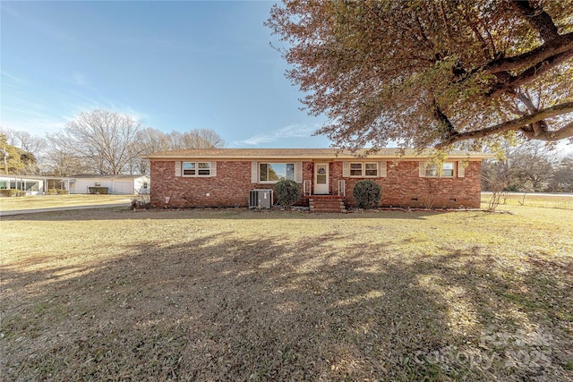 single story home with cooling unit and a front yard