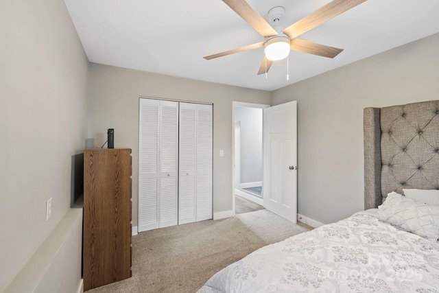 bedroom featuring light carpet, a closet, and ceiling fan