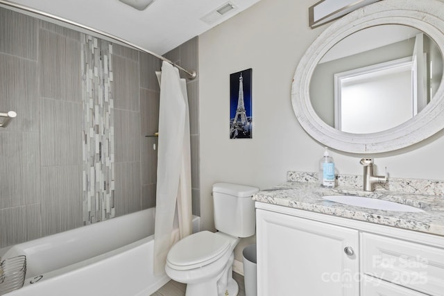 full bathroom with shower / tub combo with curtain, vanity, and toilet