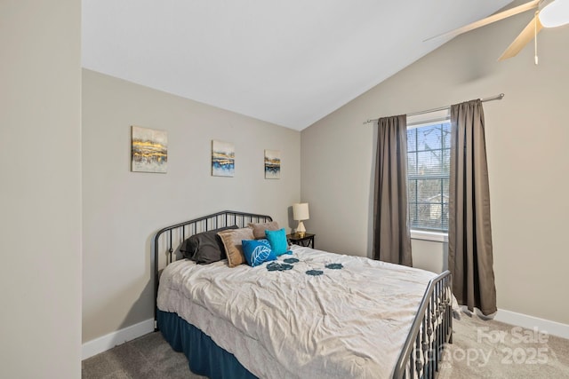 carpeted bedroom with lofted ceiling