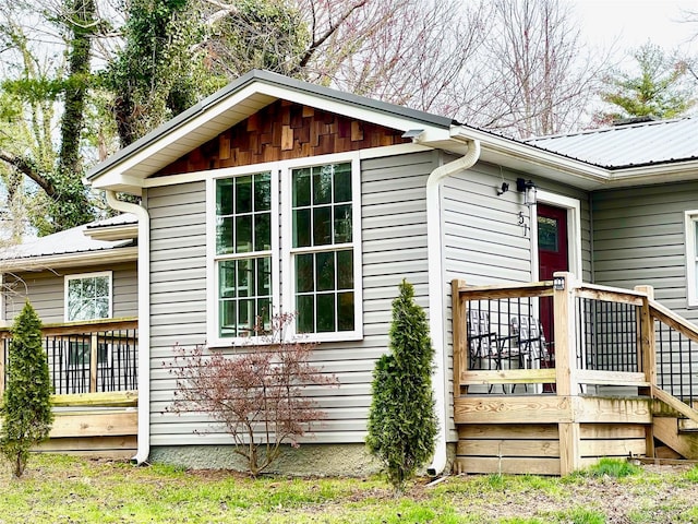 view of home's exterior featuring a deck