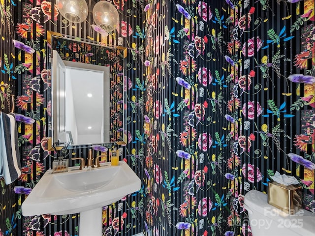 bathroom featuring sink and toilet