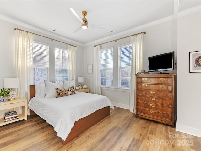 bedroom with crown molding, ceiling fan, and light wood-type flooring