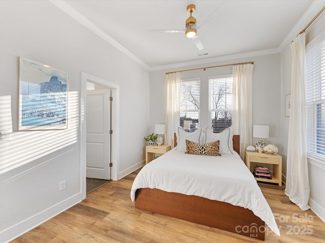 bedroom with ceiling fan, ornamental molding, and light hardwood / wood-style flooring