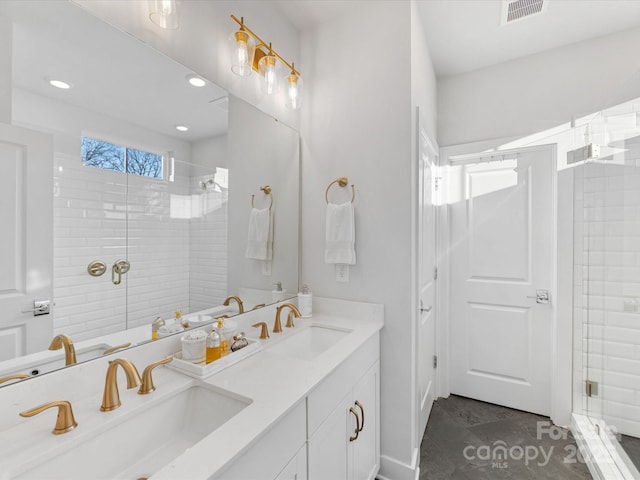 bathroom featuring vanity and a tile shower