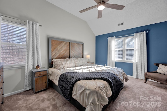 carpeted bedroom with ceiling fan and lofted ceiling