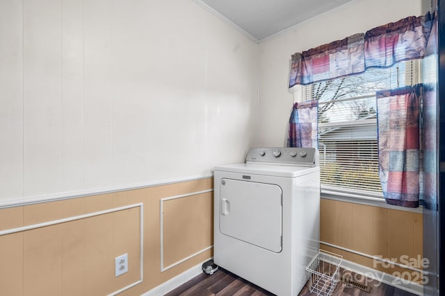 laundry area with laundry area, washer / clothes dryer, crown molding, and dark wood-type flooring