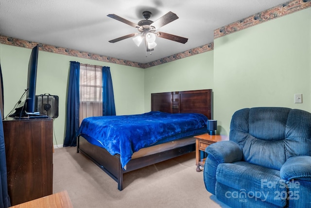 bedroom with a ceiling fan and light colored carpet