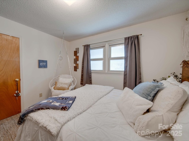 bedroom featuring a textured ceiling