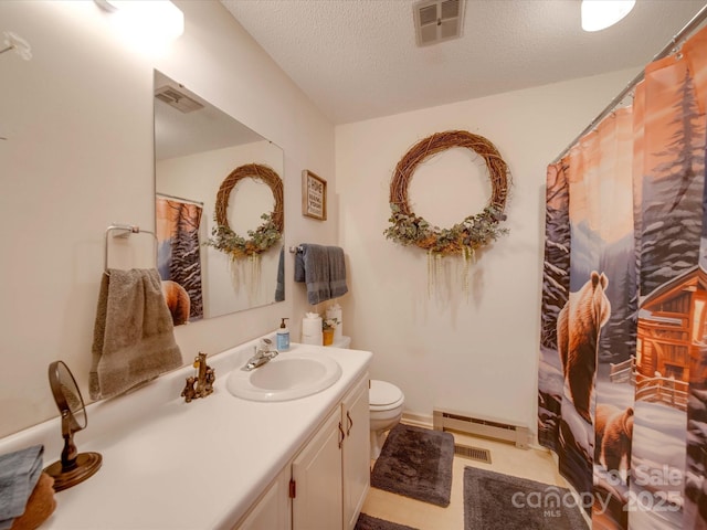 bathroom featuring vanity, a baseboard heating unit, a textured ceiling, and toilet