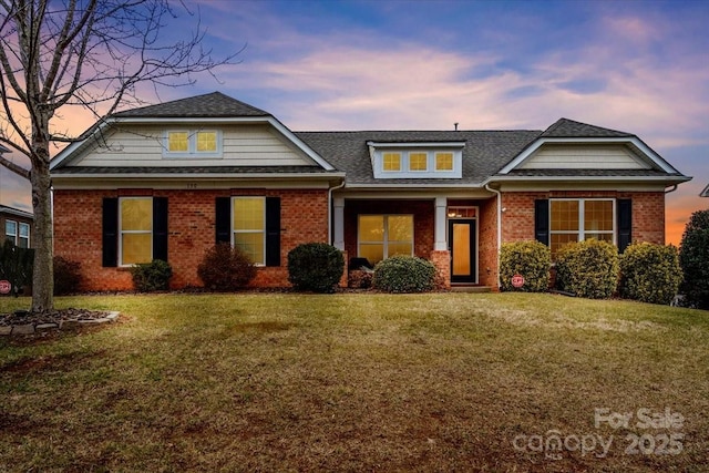 view of front of house featuring a lawn