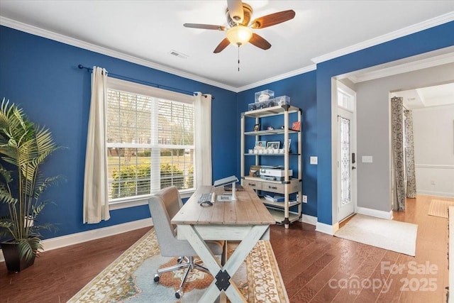 home office with dark wood-type flooring, ornamental molding, and ceiling fan