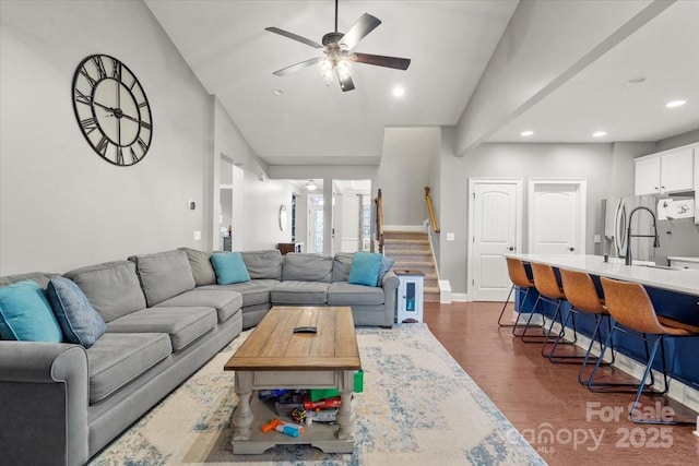 living room with vaulted ceiling, ceiling fan, dark hardwood / wood-style floors, and sink