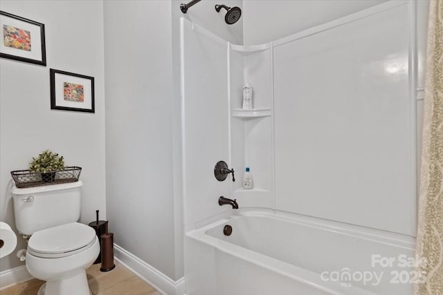 bathroom with shower / tub combo and toilet