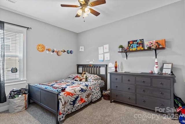 bedroom with light colored carpet and ceiling fan