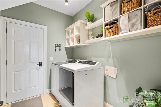 washroom featuring washing machine and clothes dryer