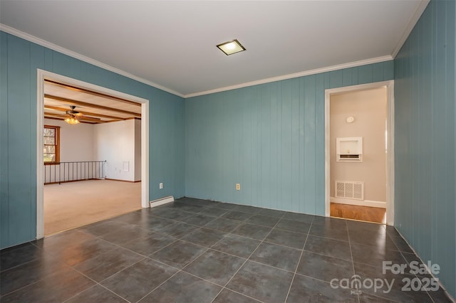 tiled empty room with ceiling fan and ornamental molding