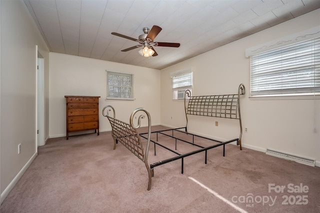 carpeted bedroom featuring baseboard heating and cooling unit