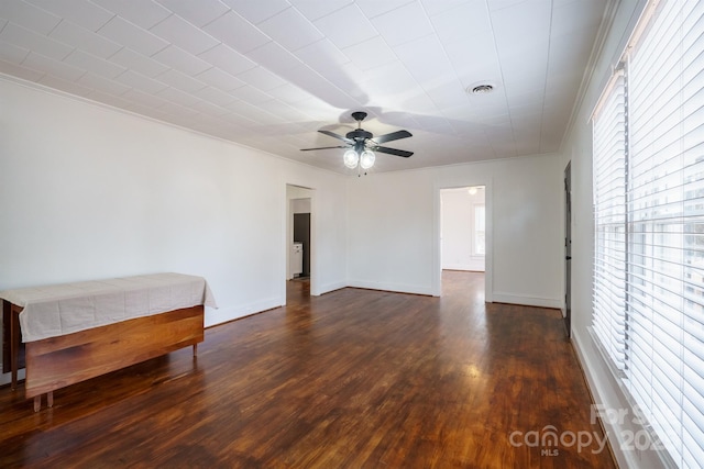 spare room with ceiling fan and dark hardwood / wood-style floors