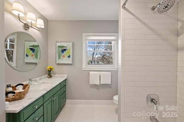 full bath with vanity, toilet, and tile patterned floors