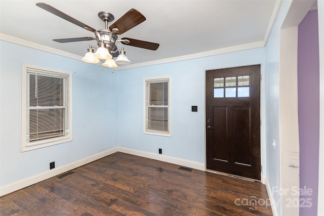 entrance foyer with ornamental molding, dark wood-type flooring, and ceiling fan