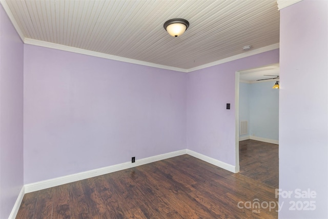 unfurnished room featuring dark hardwood / wood-style flooring and ornamental molding