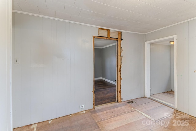 unfurnished bedroom featuring ornamental molding