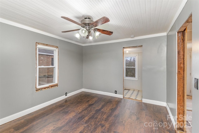 empty room with crown molding, ceiling fan, and dark hardwood / wood-style floors