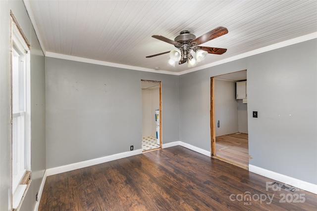 empty room with crown molding, ceiling fan, and dark hardwood / wood-style floors