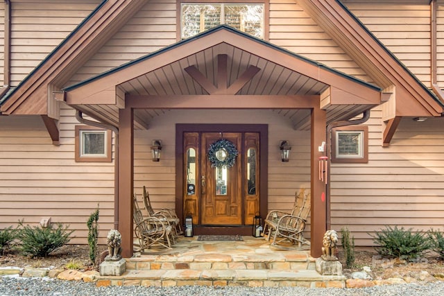 doorway to property featuring covered porch