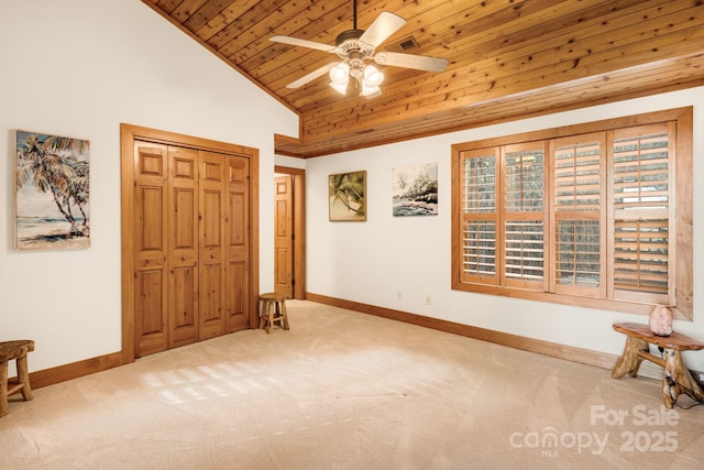 foyer entrance with ceiling fan, light colored carpet, high vaulted ceiling, and wooden ceiling