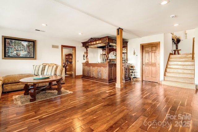 sitting room with bar and dark hardwood / wood-style floors