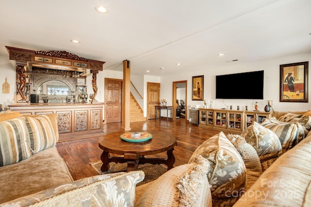 living room with dark hardwood / wood-style flooring