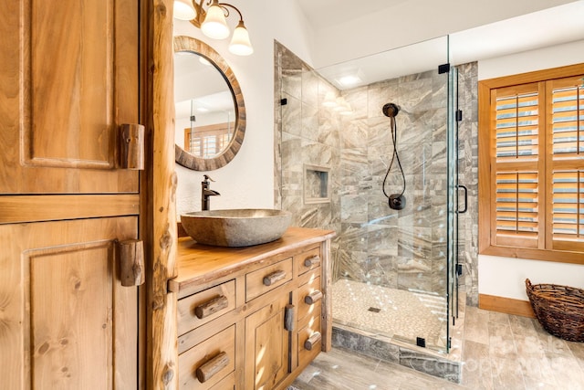 bathroom featuring vanity and a stall shower