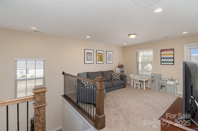 living room featuring light carpet