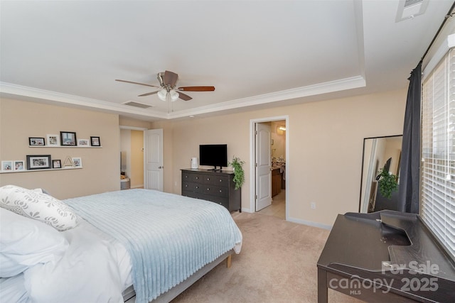 bedroom with ceiling fan, ornamental molding, a raised ceiling, and light carpet