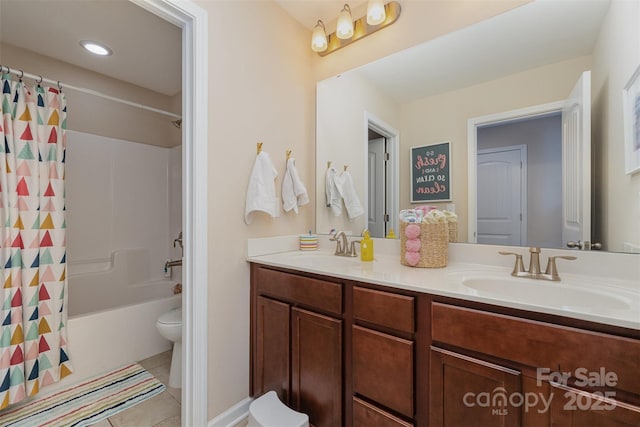 full bathroom featuring tile patterned flooring, vanity, toilet, and shower / bath combo with shower curtain