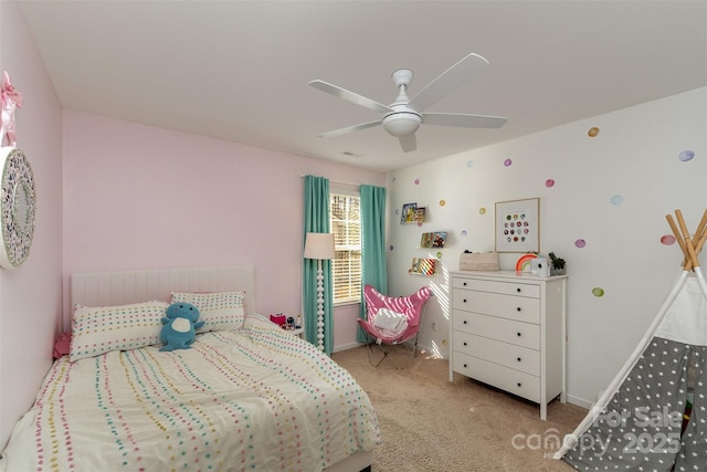 bedroom featuring light carpet and ceiling fan