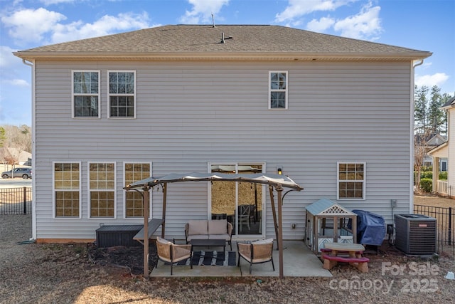 rear view of property with an outdoor living space, a patio, and central AC