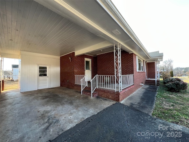 view of home's exterior featuring a carport