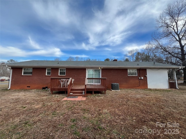 rear view of property featuring a yard, central air condition unit, and a deck