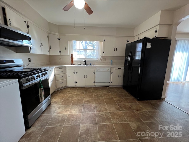 kitchen featuring sink, ceiling fan, white cabinetry, stainless steel appliances, and washer / dryer