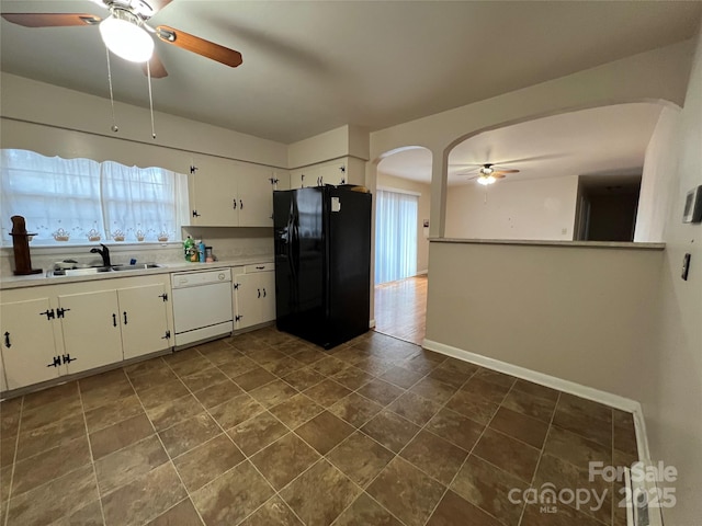 kitchen with sink, ceiling fan, white dishwasher, white cabinets, and black refrigerator with ice dispenser