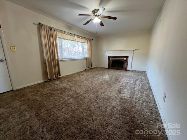 unfurnished living room featuring ceiling fan, carpet flooring, and a fireplace