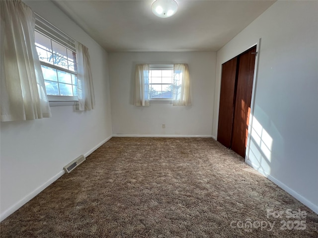 spare room featuring carpet flooring