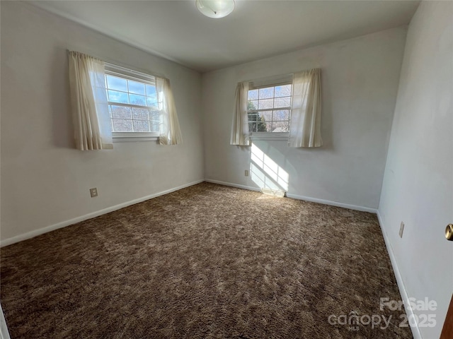 carpeted empty room featuring a healthy amount of sunlight