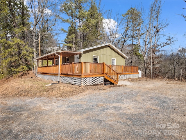 view of front of property with a wooden deck