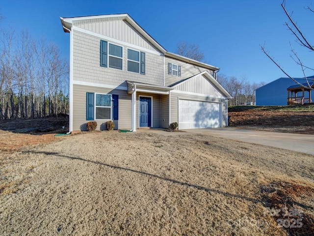 front of property featuring a garage and a front yard