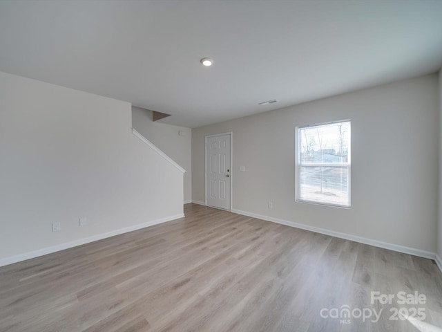 empty room with light wood-type flooring