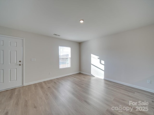 empty room featuring light hardwood / wood-style floors